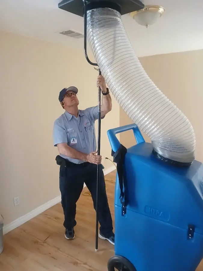 Furnace Tune-Up technician using HEPA equipment in Bellevue
